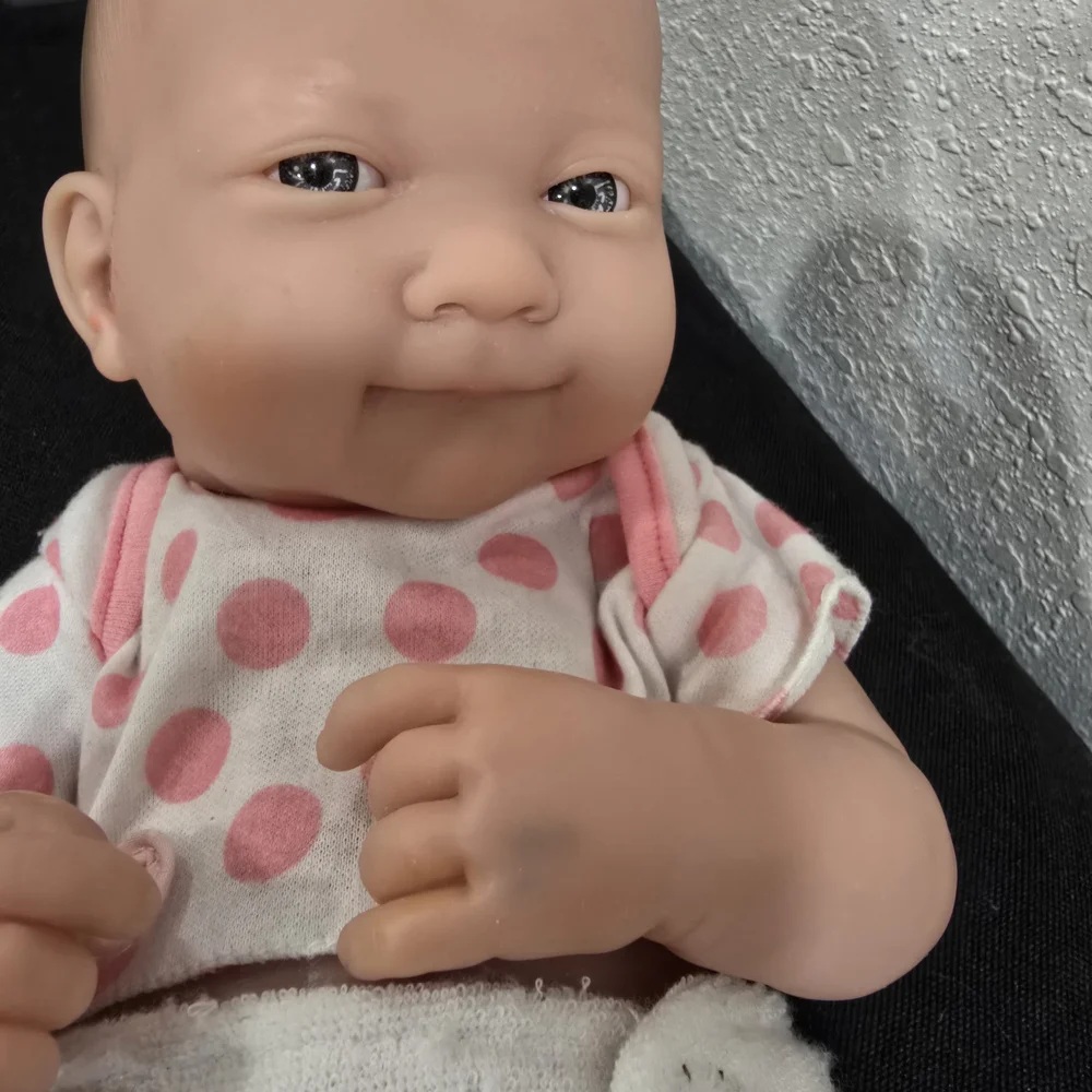 Adorable Baby Doll with Pink Polka Dot Outfit